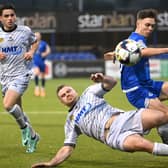 Dungannon’s Matthew Lusty is tackled by Newry’s Georgie Poynton. Picture: INPHO/Stephen Hamilton