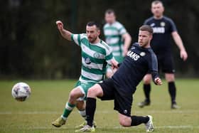 Cleary Celtic midfielder Mark Hughes battles with Newry Celtic player Stephen Wylie at Olympic Park on Saturday. Pics: Brendan Monaghan