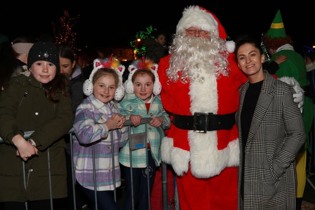 Santa Claus with Councillor Aoife Finnegan in the square in Crossmaglen after the switching on of the Christmas lights. INNR4952