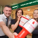 Johnny Cochrane, Hannah Fisher and Teenie Kinney from Specsavers Newry celebrate the store’s new fundraising partnership with Air Ambulance NI.