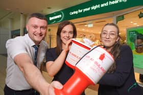 Johnny Cochrane, Hannah Fisher and Teenie Kinney from Specsavers Newry celebrate the store’s new fundraising partnership with Air Ambulance NI.