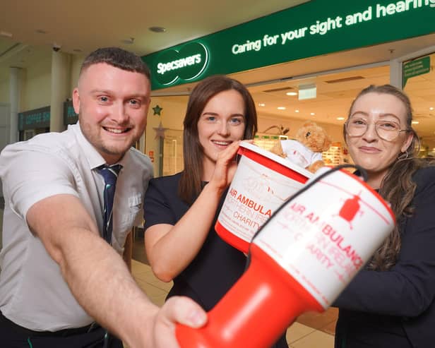 Johnny Cochrane, Hannah Fisher and Teenie Kinney from Specsavers Newry celebrate the store’s new fundraising partnership with Air Ambulance NI.