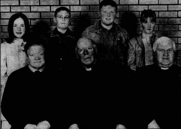 Most Rev John McAreavey, Bishop of Dromore, pictured with pupils of Glen Primary School who were confirmed in May 2002. Included are Fr Jarleth Cushenan PP and school principal Mr Donal McEvoy.