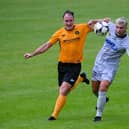Newry's Adam Salley beats Carrick Rangers defender Albert Watson to the ball during their first meeting last season. Pic: Brendan Monaghan