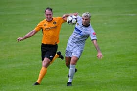 Newry's Adam Salley beats Carrick Rangers defender Albert Watson to the ball during their first meeting last season. Pic: Brendan Monaghan