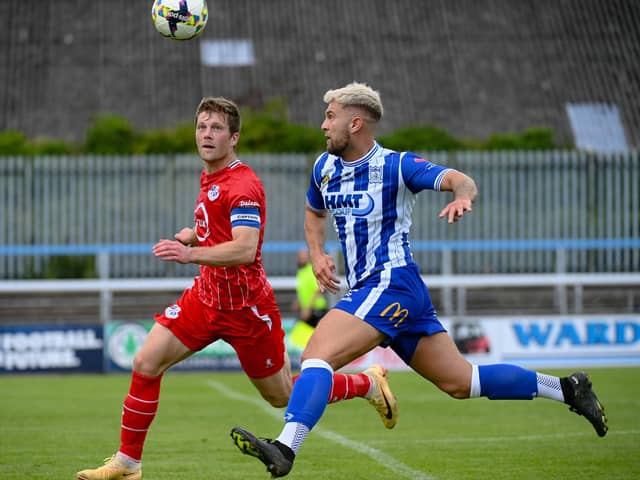 Newry City's Adam Salley with Loughgall's Ben Murdock.