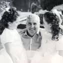 Katie and Anna Rowland with their dad, Jim.