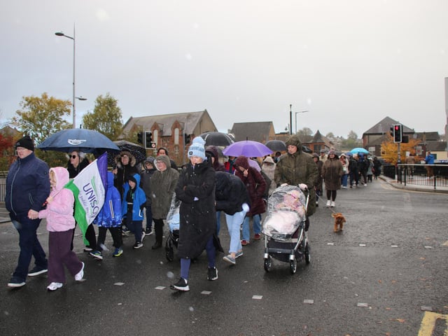THE Rally moves from Marcus Square and walks in pouring rain to Daisy Hill Hospital. INNR4339