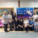 Staff pictured with the countdown clock in Daisy Hill Hospital.