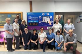 Staff pictured with the countdown clock in Daisy Hill Hospital.