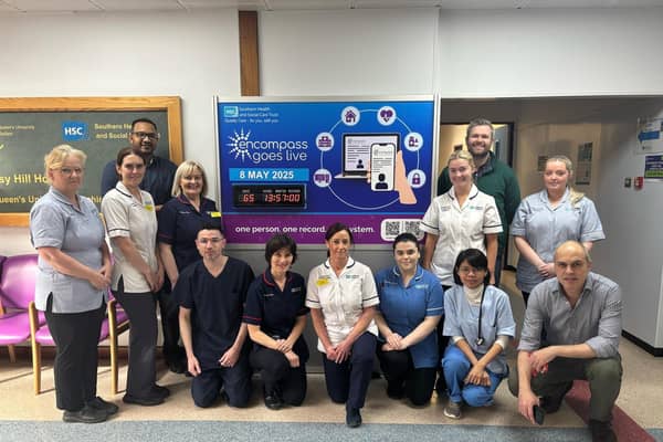 Staff pictured with the countdown clock in Daisy Hill Hospital.