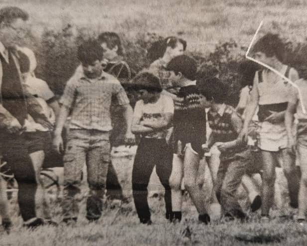 Sports day at Dromintee Primary School proved to be very successful in 1985 and all the events were keenly contested. In this picture the school's principal, Mr Gerry McQuaid, is preparing to start one of the boys' races.
