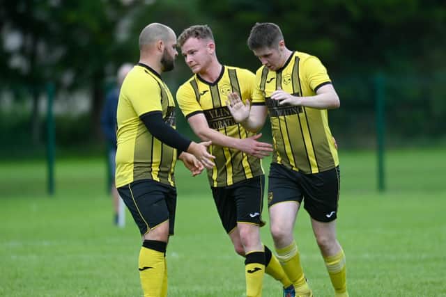 Church Street players celebrate a goal.