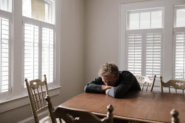 Photo by Andrew Neel: https://www.pexels.com/photo/man-in-gray-long-sleeve-shirt-sitting-on-brown-wooden-chair-5255996/