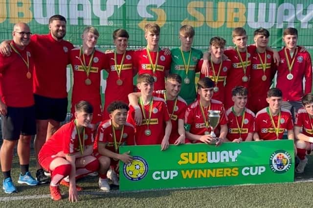 Alex Heaney with his Cliftonville U18 teammates after they won the All-Ireland Cup Winners Cup.