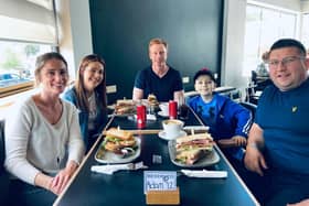 Adam Watson and family pictured with the team at Blend and Batch.