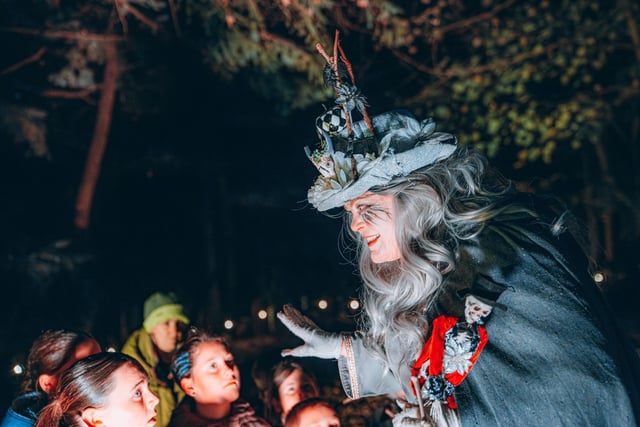 Mystified visitors listen to Samhain stories along the guided trails.