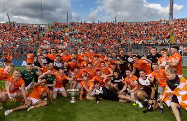 The Armagh team celebrates with the Sam Maguire Cup at Croke Park.