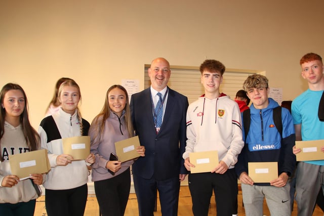 Celebrating their GCSE Results at St Paul's High School l-r Hannah Scott, Sienna Crilly, Niamh Cunningham, Principal Dáithí Murray, Jayden Leddy, Ryan McKevitt and Eoin Carroll. INNR3433