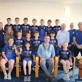 Jonesborough Primary School team for the 1st time in the school’s history won the Malachy McGeeney Cup and came home County Champions. Team is pictured with John McFearon, Eamonn Murphy Coaches, Acting Principal Marion Litter, Councillor Mickey Larkin, Coaches Philly McEvoy, Declan McCoy and the Jonesborough Primary School County Champions Team with Chairperson Newry, Mourne and Down Council, Councillor Philip Campbell who hosted a reception to recognise their achievement.