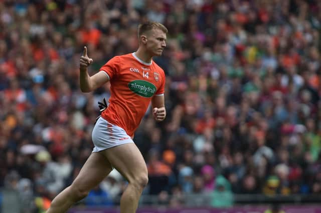 Armagh's Rian O Neill celebrates scoring his penaltv