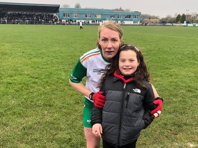 Michaela Downey with her niece, Caoimhe, after Ireland's win over Australia in Charlestown on Saturday afternoon.