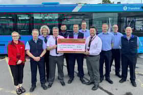 Pictured is Amy Henshaw receiving a cheque for £530 from the staff at Newry Bus Depot.