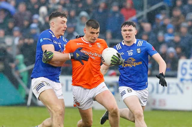 Cavan's Conor Brady and Niall Carolan and Armagh's Greg McCabe in action during the 2023 Ulster Senior Football Championship Quarter Final between Cavan and Armagh at Breffni Park Cavan. Pic Philip Walsh 04-22-2023