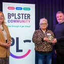 Debbie Burns pictured receiving her 'Everyday Hero' award alongside Tony Clarke (Clarke & Co) and Jacinta Linden, Bolster Community.