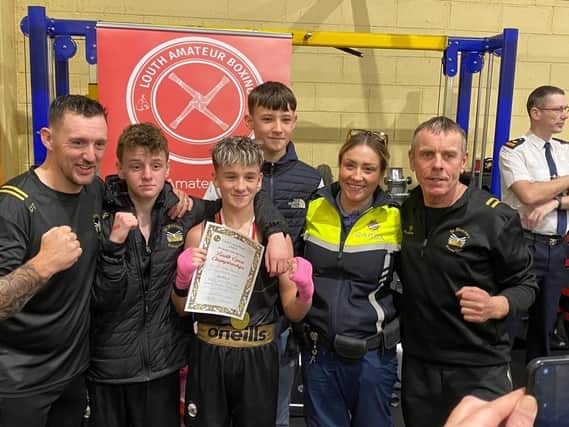Gardaí Kate Patterson presents Daniel McGuinness with his award.