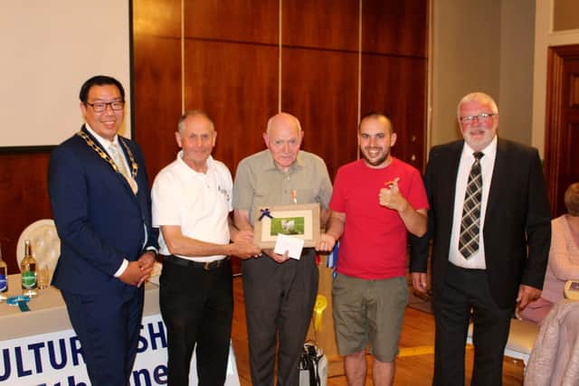 Long standing Newry Show Society member, Brian O'Hara (2nd left) receives a presentation of a framed Nathan Pierson photograph at the recent launch event for Newry Show 2025. Adding their congratulations are: Cllr David Lee-Surginor, former deputy chairman of Newry, Mourne and Down District Council; Tommy Collins, president Newry Agricultural Show Society; Nathan Pierson and Brian Lockhart, chairman of Newry Agricultural Show Society (right).