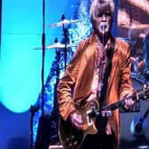 Neil Finn on stage.