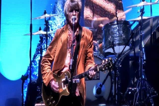 Neil Finn on stage.