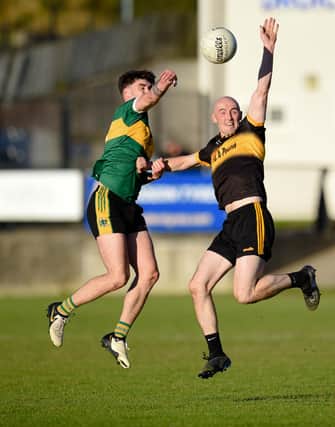 Shay Millar contest's a high ball with Bryansford Captain Sean Donegan at Mayobridge on Sunday. BM14