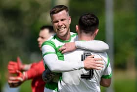 Celtic Midfielder Stephen Wylie congratulates Caolan Gray after his second goal of the game at Dromalane.