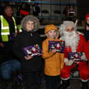 The Shields family meet Santa and receive a lovely selection box.INNR5010:.