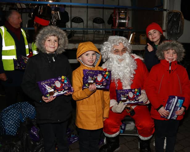 The Shields family meet Santa and receive a lovely selection box.INNR5010:.