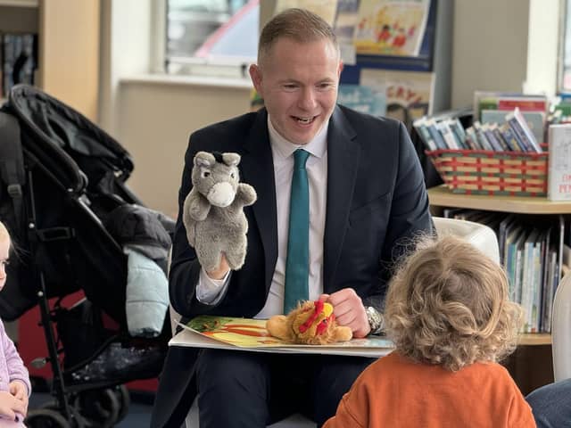 Sinn Féin MP Chris Hazzard takes part in a ‘Rhythm and Rhyme’ session at Warrenpoint Library.