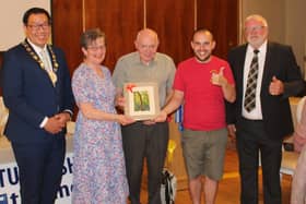 Long standing Newry Show Society member, Brendan Durkin (2nd left) receives a presentation of a framed Nathan Pierson photograph at the recent launch event for Newry Show 2025. Adding their congratulations are: Cllr David Lee-Surginor, former deputy chairman of Newry, Mourne and Down District Council; Tommy Collins, president Newry Agricultural Show Society; Nathan Pierson and Brian Lockhart, chairman of Newry Agricultural Show Society (right)