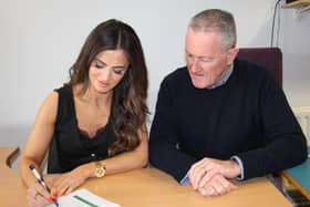 Newry and Armagh MLA Aoife Finnegan signs her nomination papers along with recently elected Seanad Éireann Seanadóir Conor Murphy.