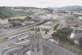 Image of Newry Cathedral and artist's impression of the new NMDDC Civic Centre. (Image from NMDDC website)
