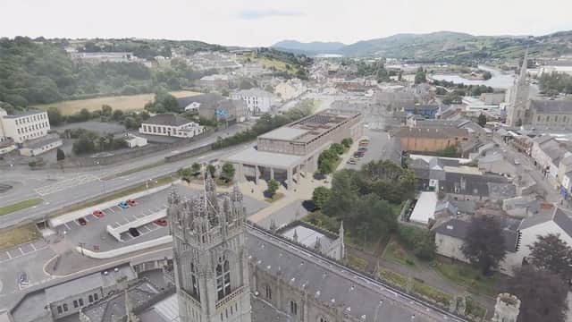 Image of Newry Cathedral and artist's impression of the new NMDDC Civic Centre. (Image from NMDDC website)