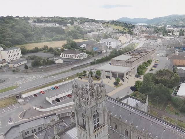 Image of Newry Cathedral and artist's impression of the new NMDDC Civic Centre. (Image from NMDDC website)