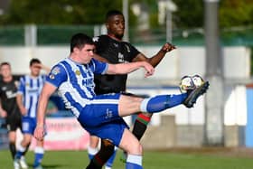 Newry City's Barney McKeown clears the ball under pressure from Glentoran striker Chukwuemeka Uzokwe at The Showgrounds. Pic: Brendan Monaghan