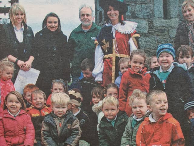 One of three classes from Seaview Nursery School which visited The Keep at Narrow Water Castle, pictured with warden James McEvoy and principal Miss Sheila McGinniss.