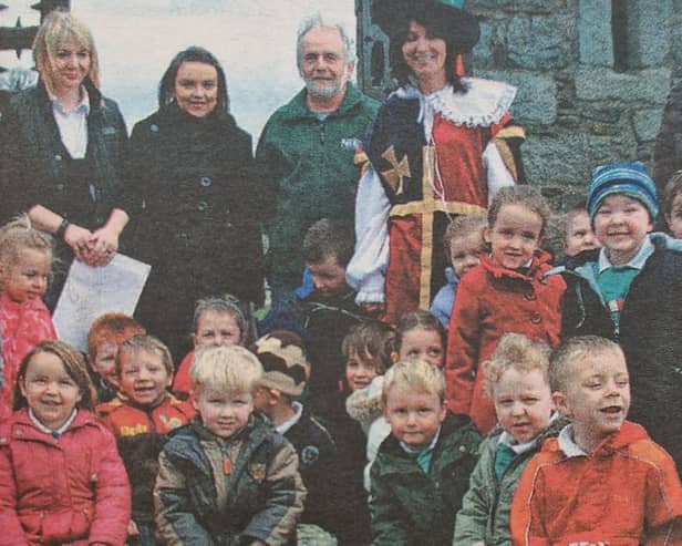 One of three classes from Seaview Nursery School which visited The Keep at Narrow Water Castle, pictured with warden James McEvoy and principal Miss Sheila McGinniss.