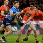Armagh's Rory Grugan puts a tackle in on Dublin's Aaron Byrne during the two counties' league meeting in 2022.