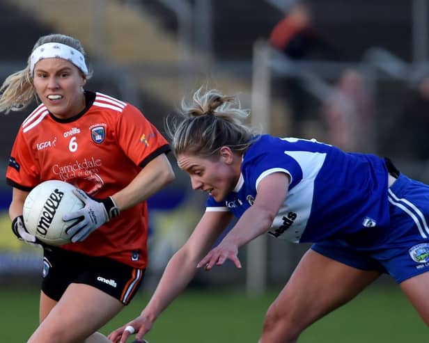 Armagh's Lauren McConville goes around Laois's Sarah Ann Fitzgerald