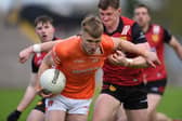 Armagh's Rian O'Neill is put under pressure by Ryan McEvoy. Pic: Brendan Monaghan