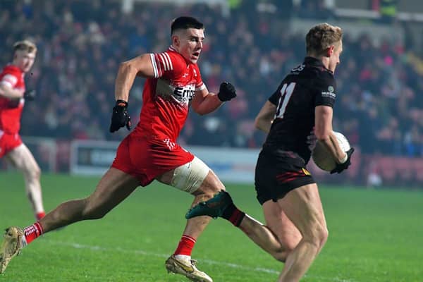 Derry’s Conor Doherty tracks Down’s Liam Kerr. Photo: George Sweeney